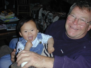 Dad and Xinya at one year old